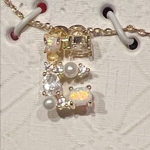 Elegant Gold and White Gemstone Necklace